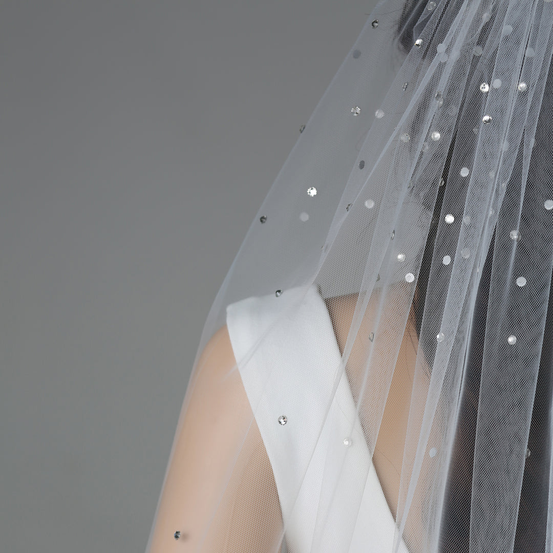 Close-up of FS6256 lace embroidery with rhinestones and pearls.
