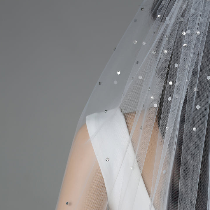 Close-up of FS6256 lace embroidery with rhinestones and pearls.