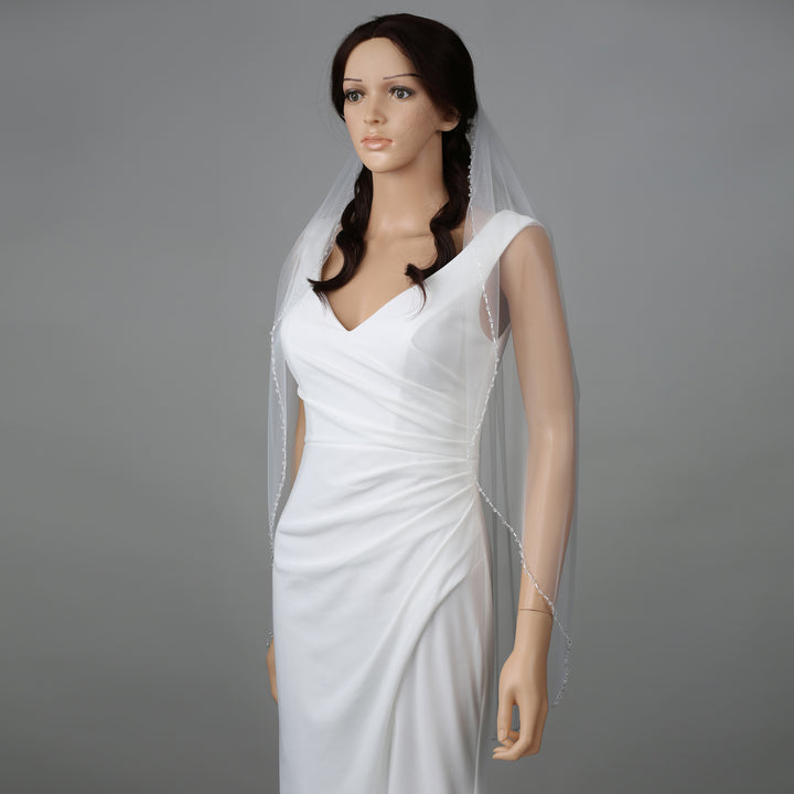 Side view of FS6263 showcasing scalloped lace edges and elegant flow.