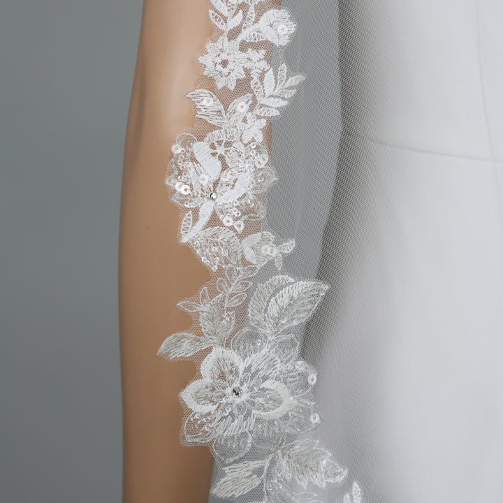 FS6276 rear view showcasing dramatic flow and intricate embroidery.
