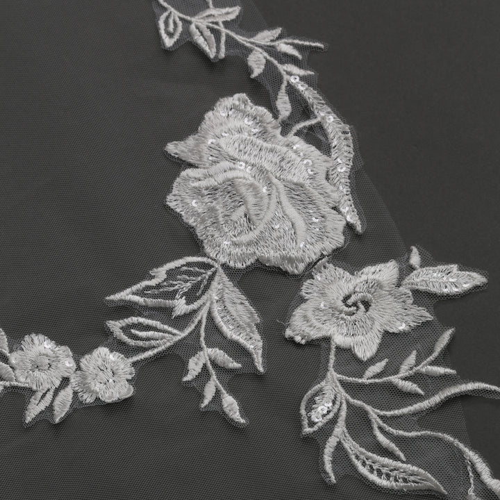 FS6277 rear view showcasing dramatic flow and intricate embroidery.
