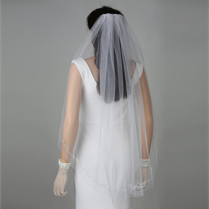 FS6341 bridal veil styled on mannequin, highlighting mid-length design.