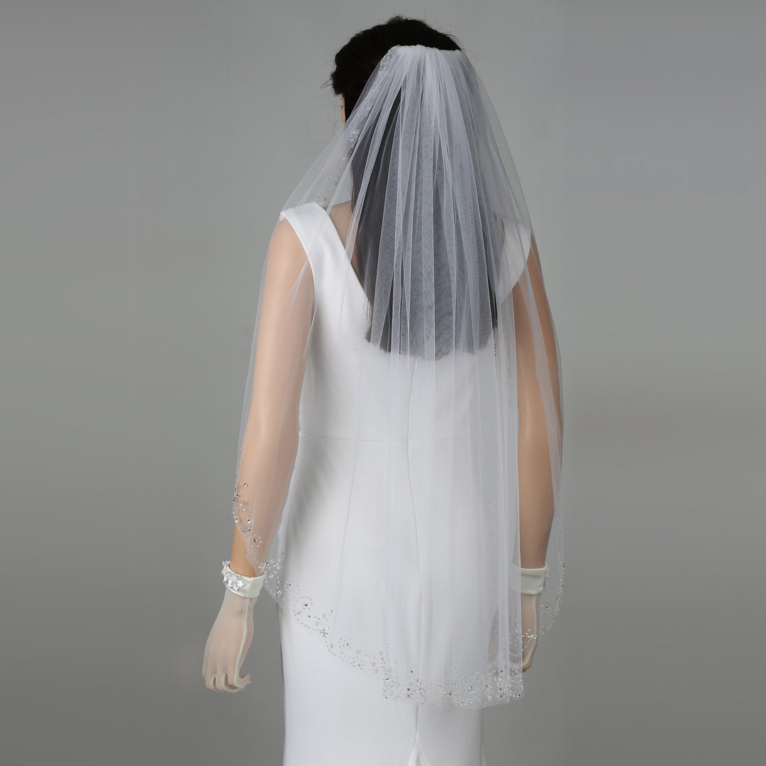 FS6346 bridal veil styled on mannequin, highlighting fingertip-length design.