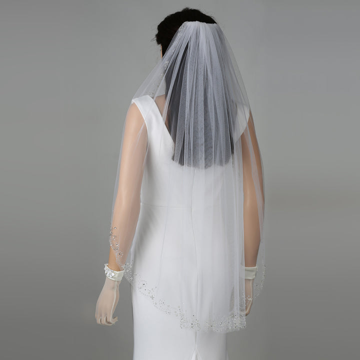 FS6346 bridal veil styled on mannequin, highlighting fingertip-length design.