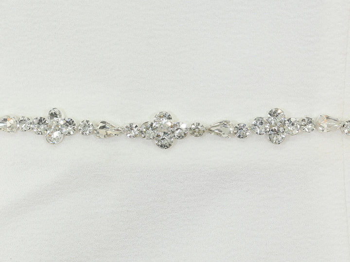 Close-up of S1002 detailing with rhinestones and pearls.