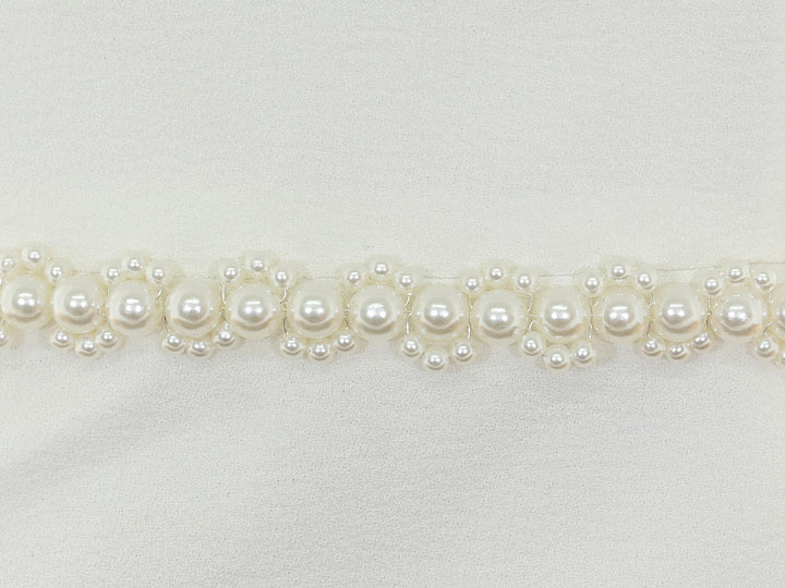Close-up of S1005 detailing with bead and rhinestone accents.