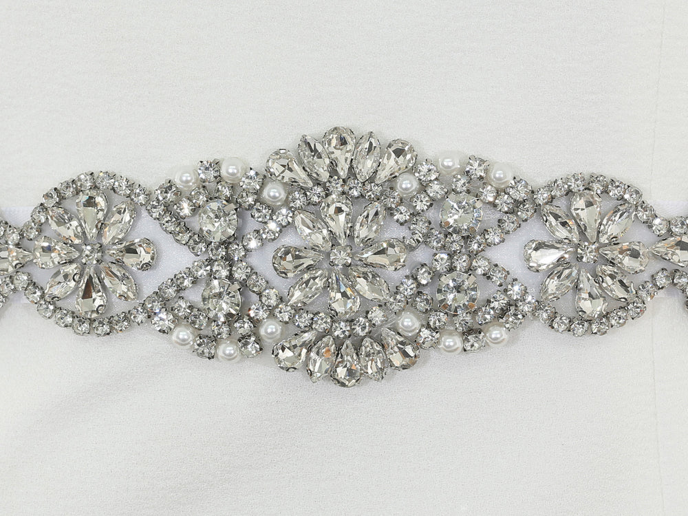 Close-up of S1009 lace embroidery with rhinestones and pearls.