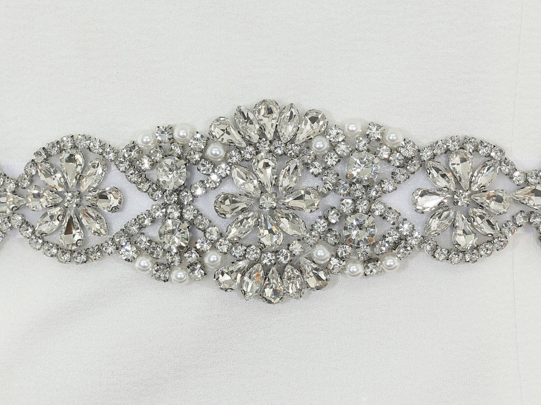 Close-up of S1009 lace embroidery with rhinestones and pearls.