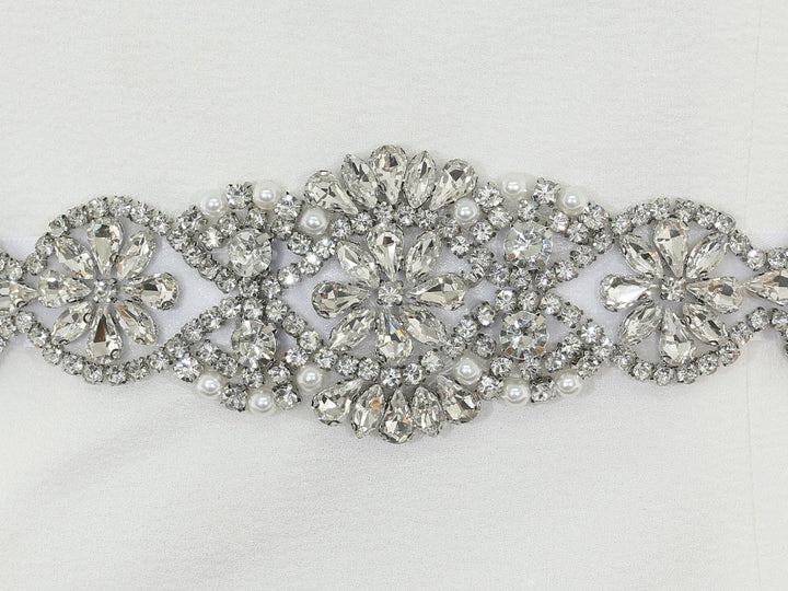 Close-up of S1009 lace embroidery with rhinestones and pearls.