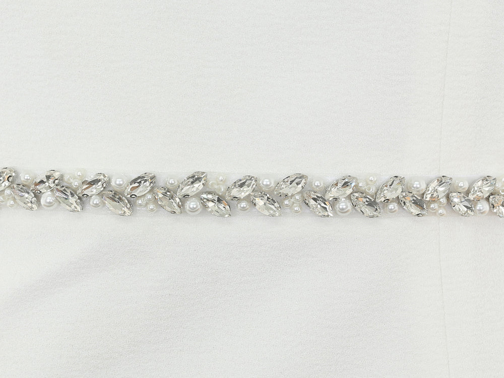 Close-up of S1010 detailing with rhinestones and pearls.