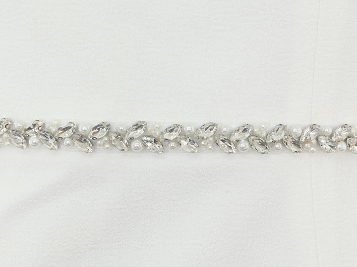 Close-up of S1010 detailing with rhinestones and pearls.